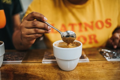 On the white ceramic bowl with silver spoon
